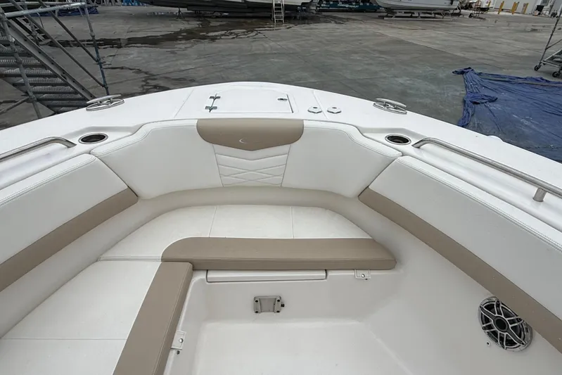  Yacht Photos Pics 2024 Robalo R317 Dual Console boat interior with cushioned seating and cup holders.