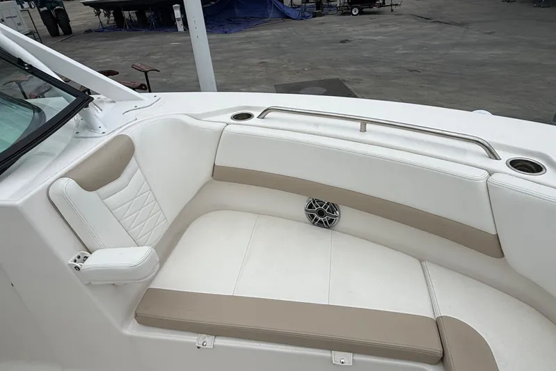  Yacht Photos Pics 2024 Robalo R317 Dual Console boat interior with cushioned seating and cup holders.