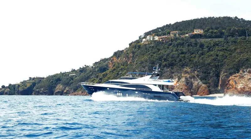  Yacht Photos Pics Luxury yacht Couach 3000 Fly cruising near a scenic coastline, 2006 model.