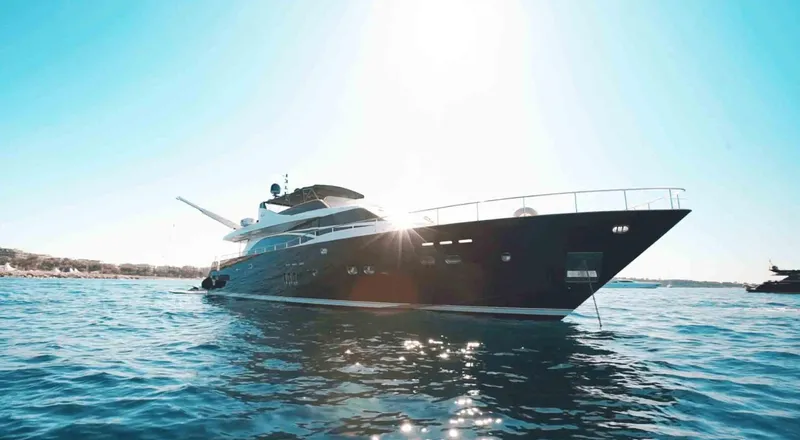  Yacht Photos Pics Luxury yacht Couach 3000 Fly 2006 on serene blue waters under bright sun.