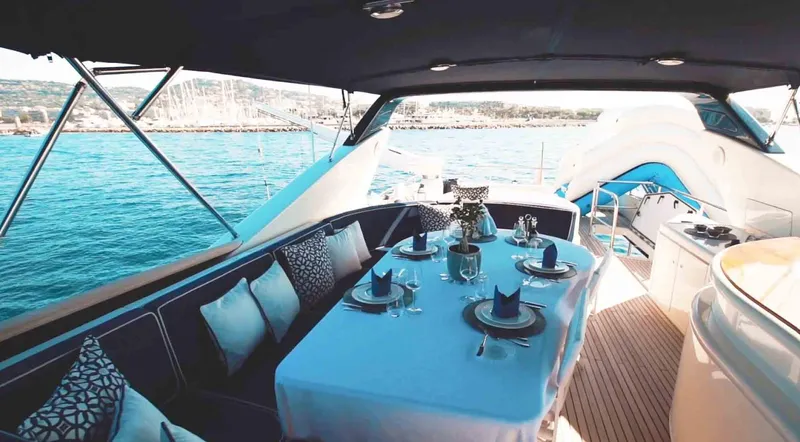  Yacht Photos Pics Luxury dining area on 2006 Couach 3000 Fly yacht with ocean view.