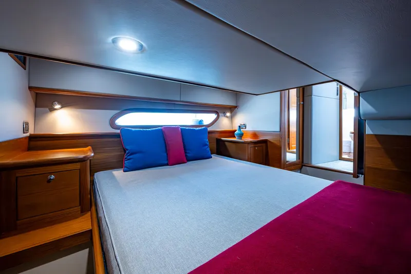 Duet Yacht Photos Pics Luxurious cabin interior of 2017 Grand Banks 44 Eastbay SX yacht, featuring elegant wood finishes.