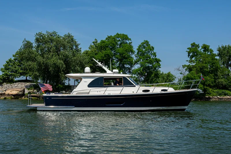 Duet Yacht Photos Pics 2017 Grand Banks 44 Eastbay SX yacht cruising on a scenic waterway.