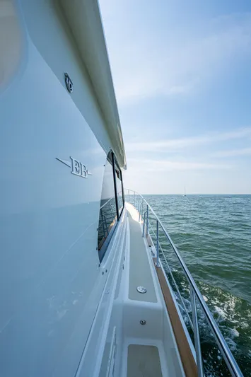 Duet Yacht Photos Pics 2017 Grand Banks 44 Eastbay SX yacht cruising on open sea under clear blue sky.