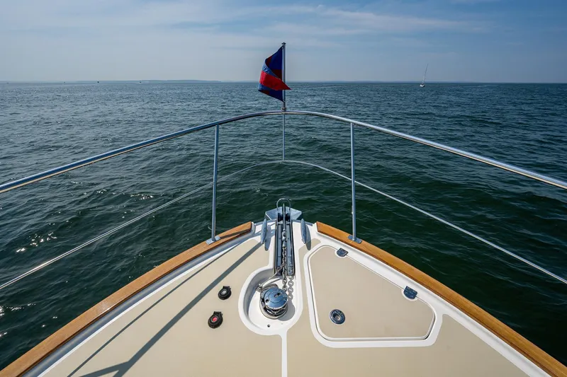 Duet Yacht Photos Pics Bow view of 2017 Grand Banks 44 Eastbay SX yacht on open water.