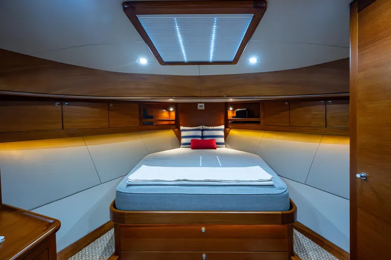 Duet Yacht Photos Pics Luxurious cabin interior of 2017 Grand Banks 44 Eastbay SX yacht, featuring elegant wood finishes.