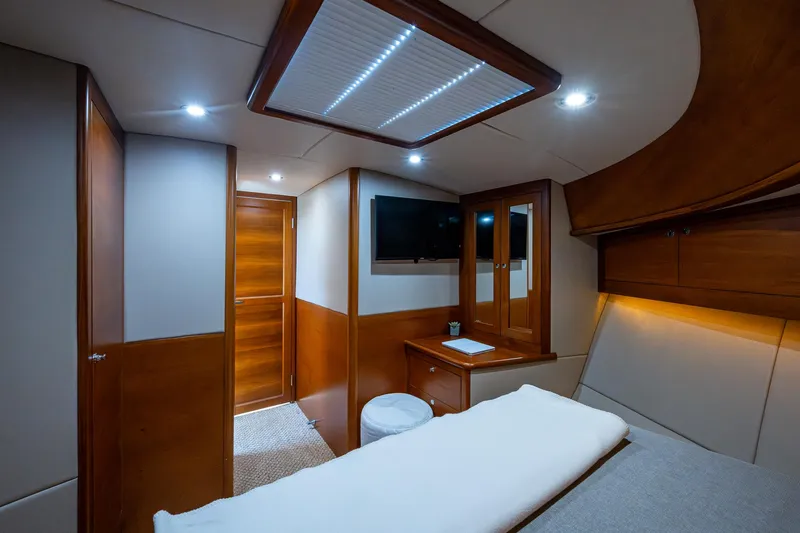Duet Yacht Photos Pics Luxurious cabin interior of 2017 Grand Banks 44 Eastbay SX yacht, featuring wood accents and modern lighting.