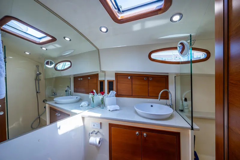 Duet Yacht Photos Pics Luxurious bathroom interior of 2017 Grand Banks 44 Eastbay SX yacht with modern fixtures.