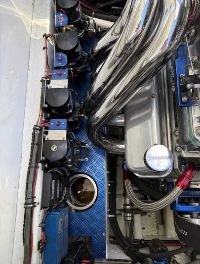  Yacht Photos Pics Engine compartment of a 1994 Apache 47 Fire Water boat with chrome components.