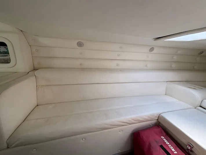  Yacht Photos Pics Interior of a 1994 Apache 47 Fire Water boat with white cushioned seating.