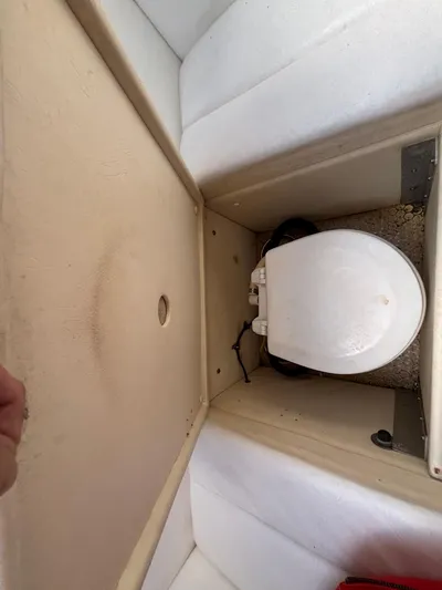  Yacht Photos Pics 1994 Apache 47 Fire Water boat interior with compact toilet setup.