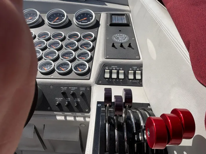  Yacht Photos Pics Dashboard of a 1994 Apache 47 Fire Water boat with gauges and controls.