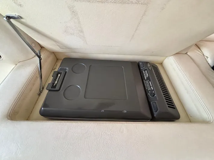  Yacht Photos Pics Built-in cooler in 1994 Apache 47 Fire Water boat interior compartment.