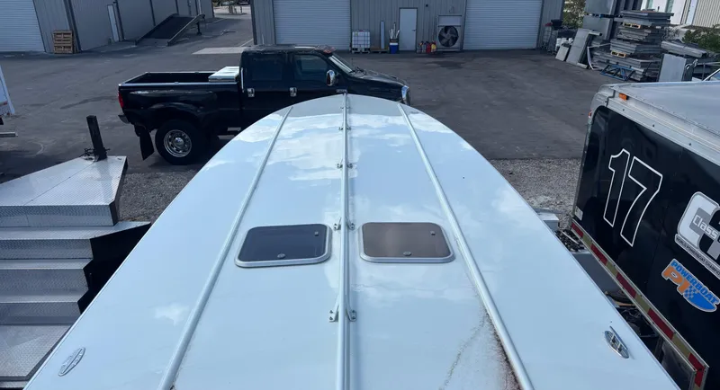  Yacht Photos Pics Top view of a 1994 Apache 47 Fire Water boat in an industrial area.