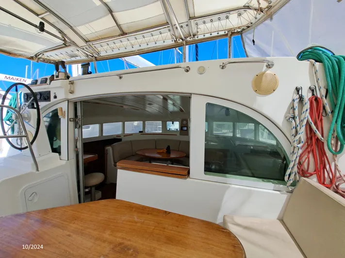 Tortuga Yacht Photos Pics Lagoon 380 catamaran interior, 2001 model, featuring spacious seating and nautical equipment.