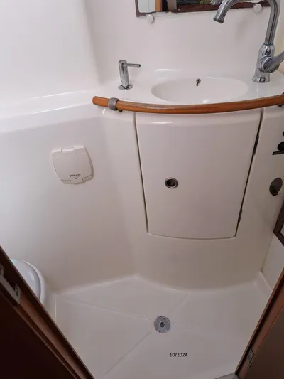 Tortuga Yacht Photos Pics Compact bathroom in 2001 Lagoon 380 catamaran with sink and faucet.