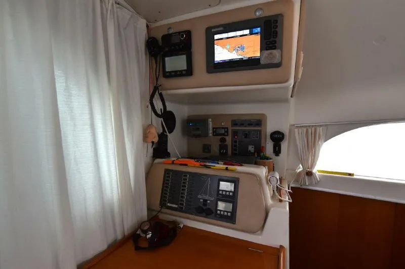 Tortuga Yacht Photos Pics Control panel of a 2001 Lagoon 380 catamaran with navigation equipment.