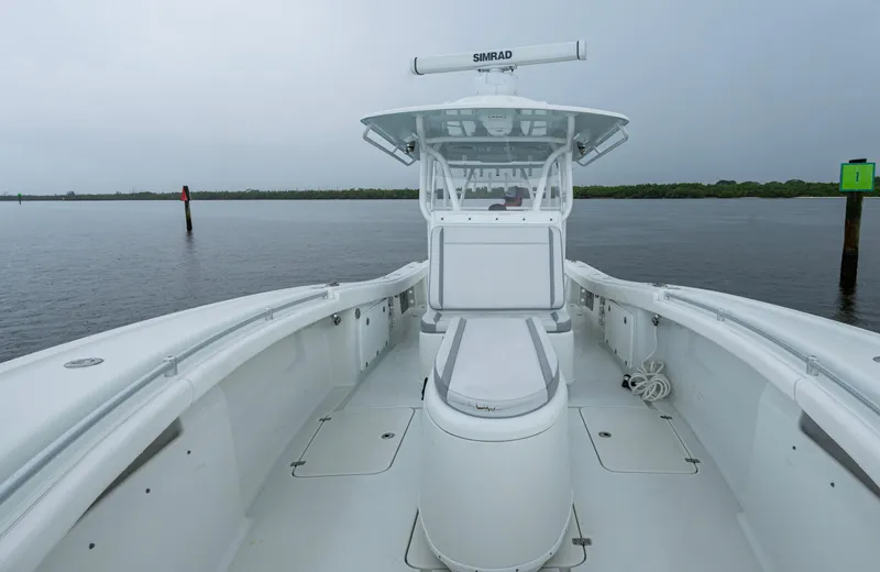  Yacht Photos Pics 2018 Yellowfin 36 Offshore boat on calm water, featuring spacious deck and advanced navigation system.