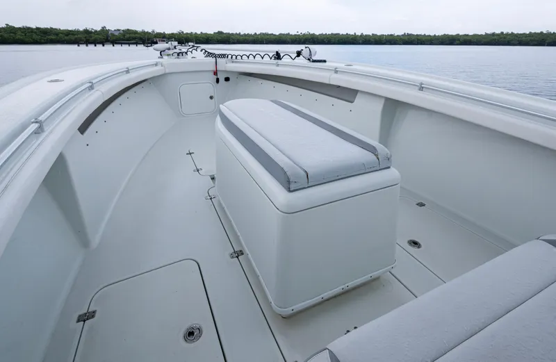  Yacht Photos Pics 2018 Yellowfin 36 Offshore boat interior with seating and storage, on calm water.