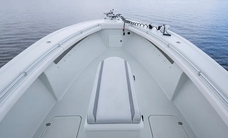  Yacht Photos Pics 2018 Yellowfin 36 Offshore boat bow with seating, on calm water.