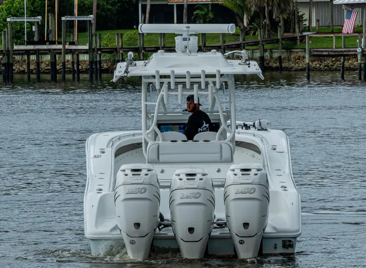 Yacht Photos Pics 2018 Yellowfin 36 Offshore boat with triple 350 engines on a calm waterway.