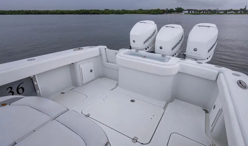  Yacht Photos Pics 2018 Yellowfin 36 Offshore boat with triple Mercury engines on calm water.