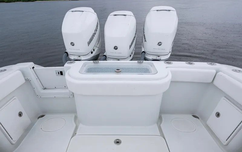  Yacht Photos Pics 2018 Yellowfin 36 Offshore boat with triple Mercury outboard engines on calm water.