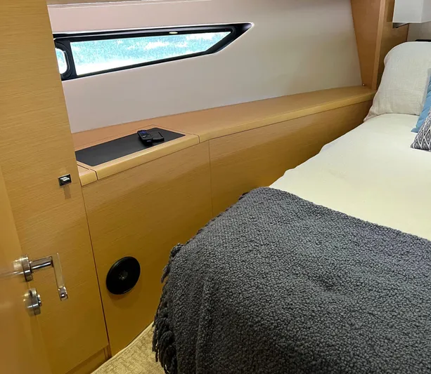 The Best Day Ever Yacht Photos Pics Cozy cabin interior of 2013 Prestige 500 S yacht with bed and window.