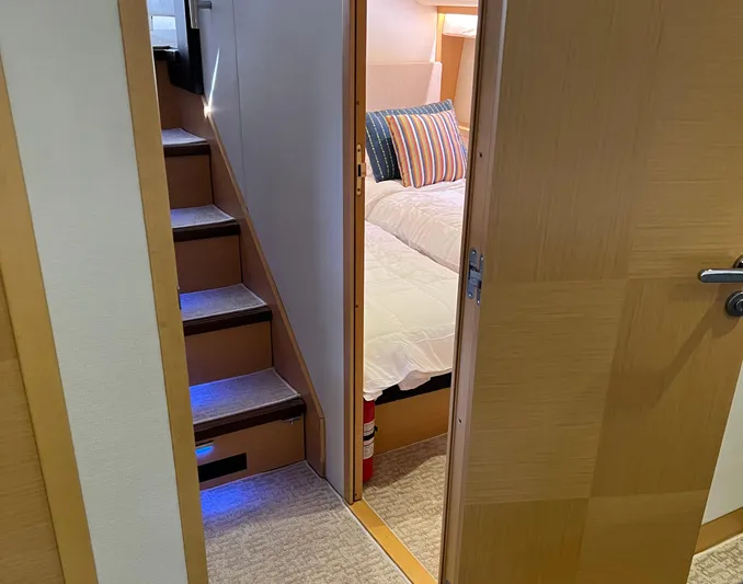 The Best Day Ever Yacht Photos Pics Interior of 2013 Prestige 500 S yacht showing stairs and cozy bedroom.