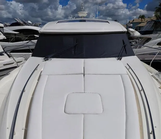The Best Day Ever Yacht Photos Pics 2013 Prestige 500 S yacht with sleek design, docked under cloudy sky.
