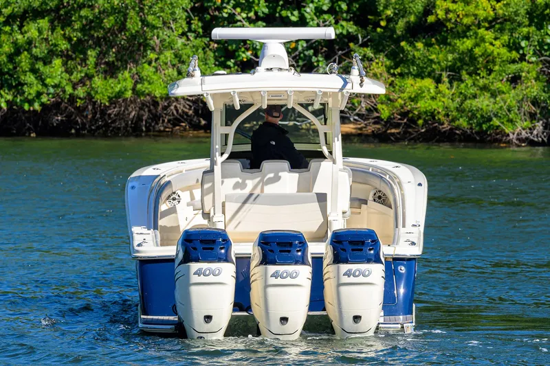 W/seakeeper Yacht Photos Pics 2023 Scout 355 LXF boat with triple 400 horsepower engines on water.