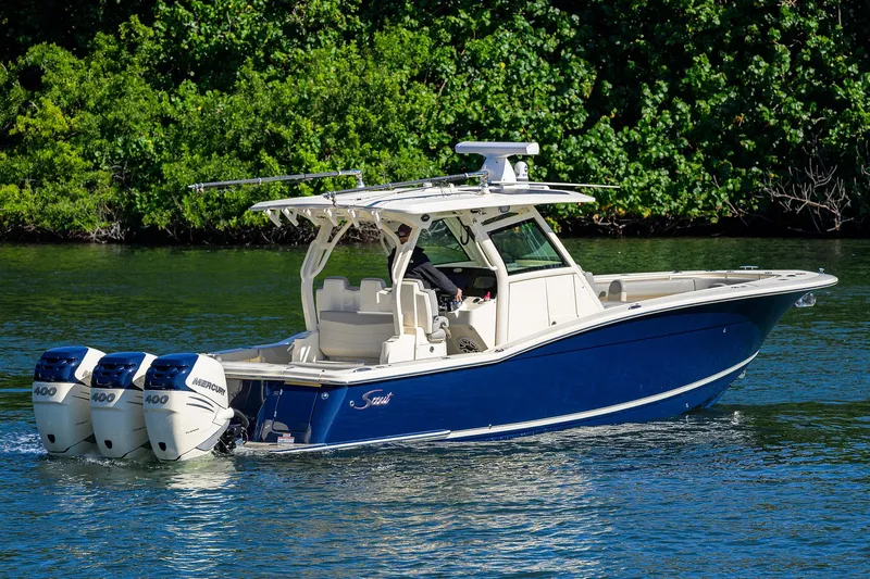 W/seakeeper Yacht Photos Pics 2023 Scout 355 LXF boat with triple engines on a scenic waterway.