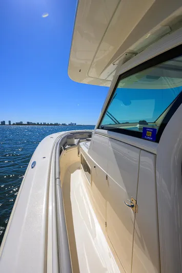 W/seakeeper Yacht Photos Pics 2023 Scout 355 LXF boat on water, showcasing sleek design and modern features.