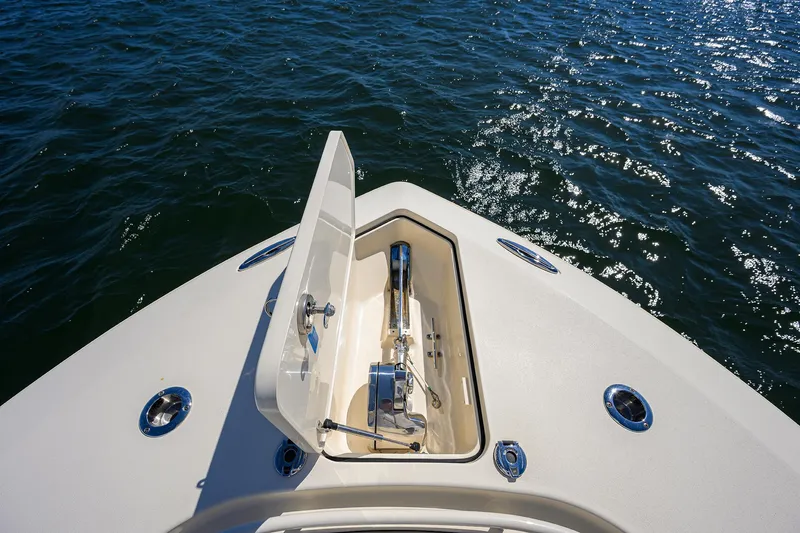 W/seakeeper Yacht Photos Pics 2023 Scout 355 LXF boat anchor compartment open on calm water.