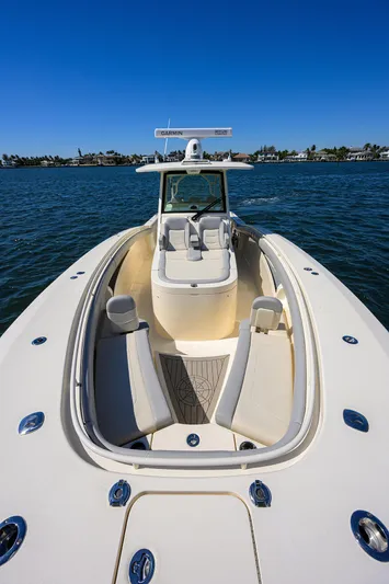 W/seakeeper Yacht Photos Pics 2023 Scout 355 LXF boat on water, showcasing sleek design and spacious seating.