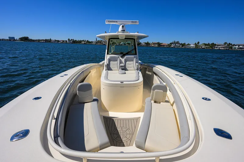 W/seakeeper Yacht Photos Pics 2023 Scout 355 LXF boat on water, showcasing sleek design and spacious seating.