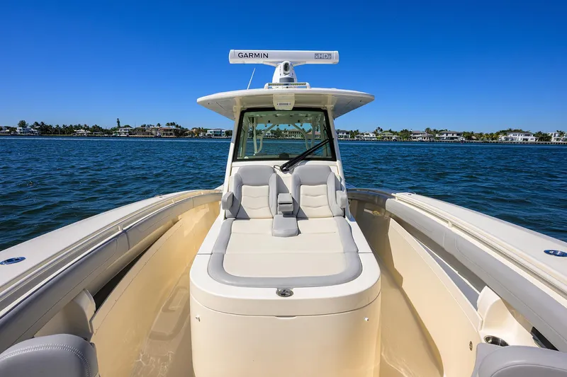 W/seakeeper Yacht Photos Pics 2023 Scout 355 LXF boat on water, featuring sleek design and spacious seating.