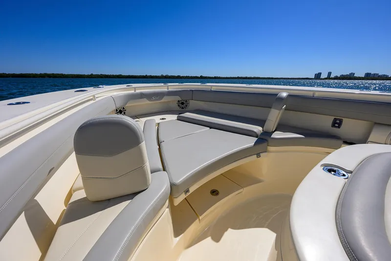 W/seakeeper Yacht Photos Pics 2023 Scout 355 LXF boat interior with luxurious seating and ocean view.