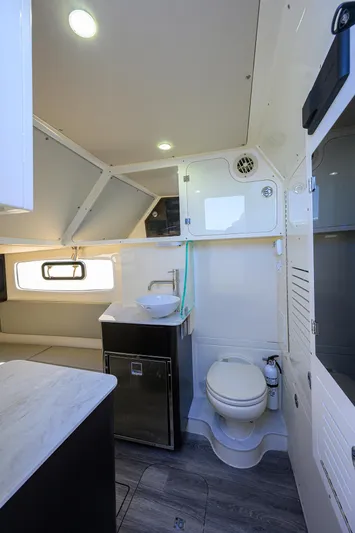 W/seakeeper Yacht Photos Pics 2023 Scout 355 LXF boat interior with modern bathroom amenities.