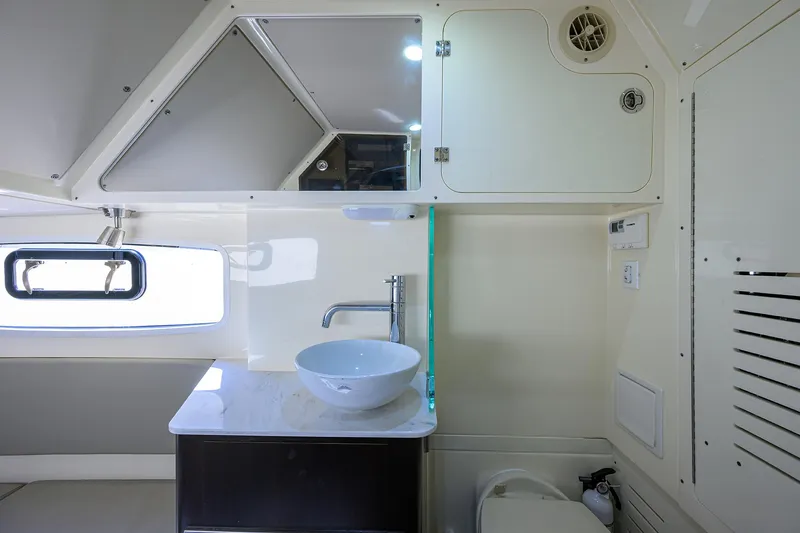 W/seakeeper Yacht Photos Pics 2023 Scout 355 LXF boat interior with modern sink and cabinetry.