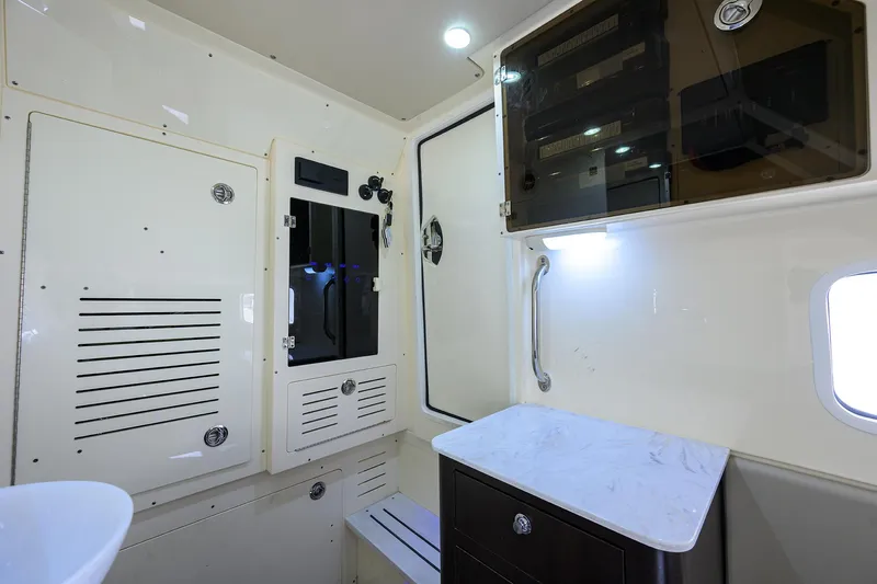 W/seakeeper Yacht Photos Pics 2023 Scout 355 LXF cabin interior with modern cabinetry and sleek design.