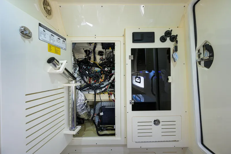 W/seakeeper Yacht Photos Pics 2023 Scout 355 LXF boat interior showing electrical wiring and control panel.