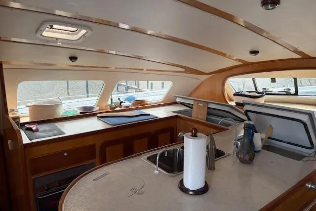  Yacht Photos Pics Interior of 2004 Soubise Plaisance Freydis 46 catamaran, featuring spacious kitchen area.