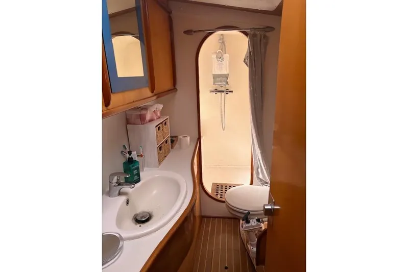  Yacht Photos Pics Bathroom interior of 2004 Soubise Plaisance Freydis 46 yacht, featuring sink and shower.