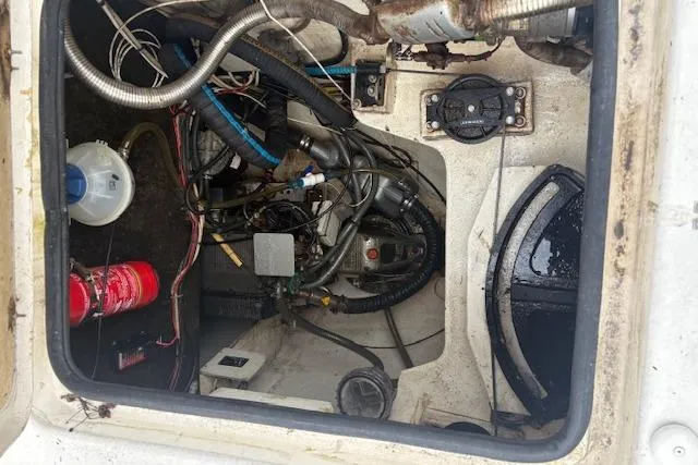  Yacht Photos Pics Engine compartment of 2004 Soubise Plaisance Freydis 46, showing mechanical components and wiring.