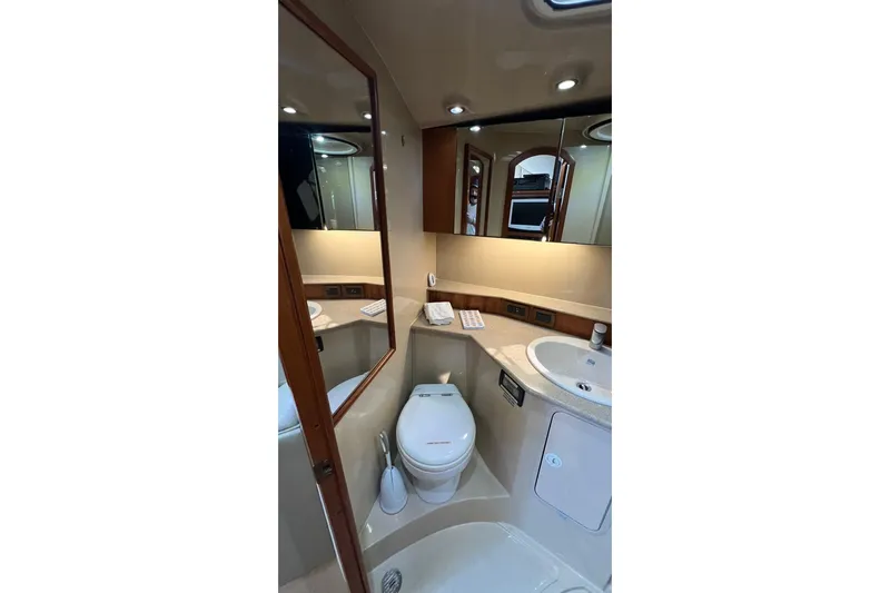 Clean Fun Yacht Photos Pics Luxurious bathroom in 2005 Rampage 38 Express yacht with modern fixtures and elegant design.