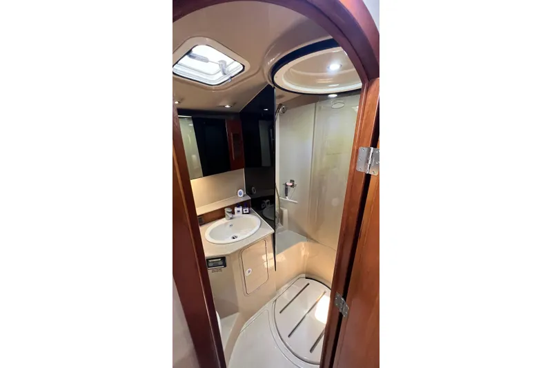 Clean Fun Yacht Photos Pics Luxurious bathroom in 2005 Rampage 38 Express yacht with shower and sink.