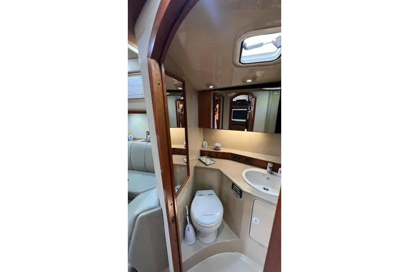 Clean Fun Yacht Photos Pics Luxurious bathroom interior of 2005 Rampage 38 Express yacht, featuring modern amenities.