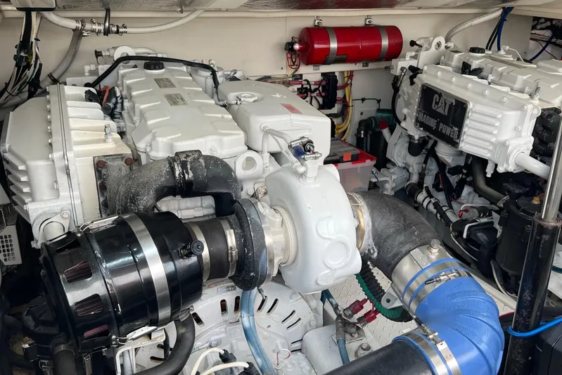 Clean Fun Yacht Photos Pics Engine room of a 2005 Rampage 38 Express boat, featuring CAT marine power systems.