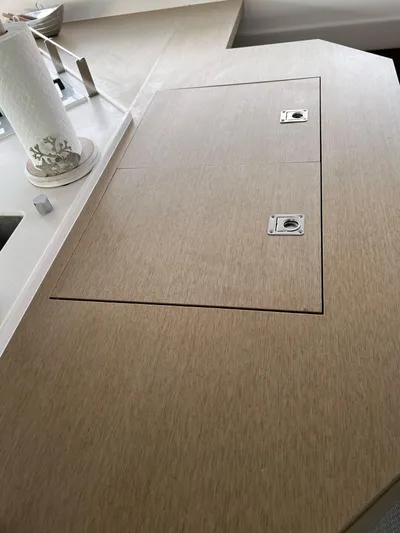 Tri It Yacht Photos Pics Wooden countertop with built-in storage on a 2018 NEEL 51 model.
